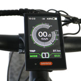 Close up of the Bafang display of the Eunorau Specter S Electric Mountain bike against a blurred white background.