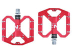 NEXT GEN ENZO flat foot mountain bike pedals in red colour. Top view against a white background.